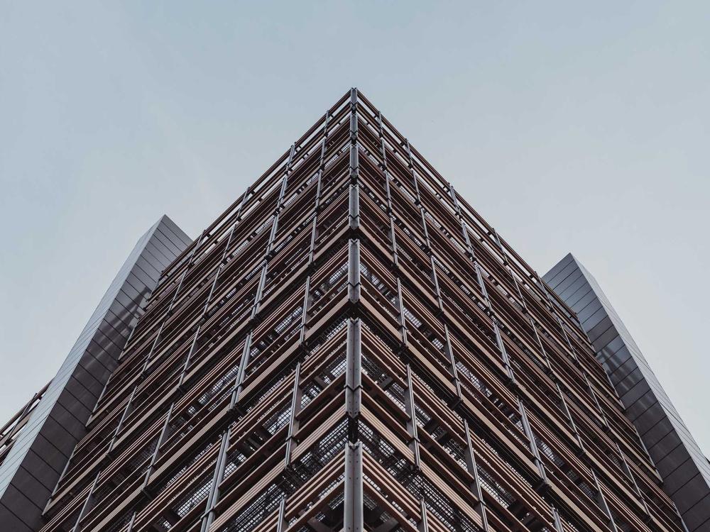 A modern building rising in a developing skyline